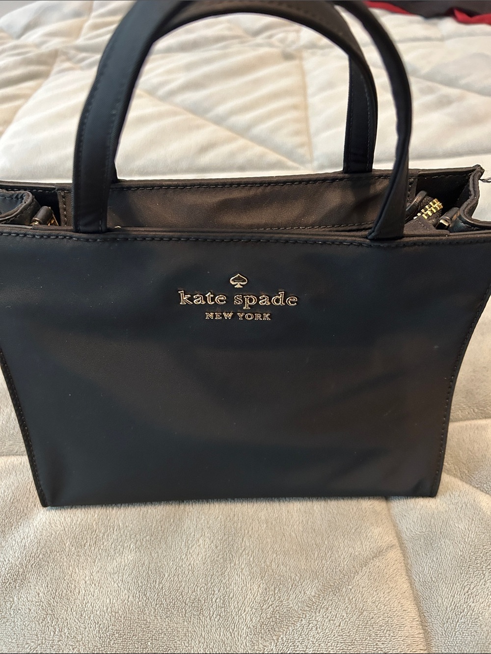 kate spade black handbag with gold logo